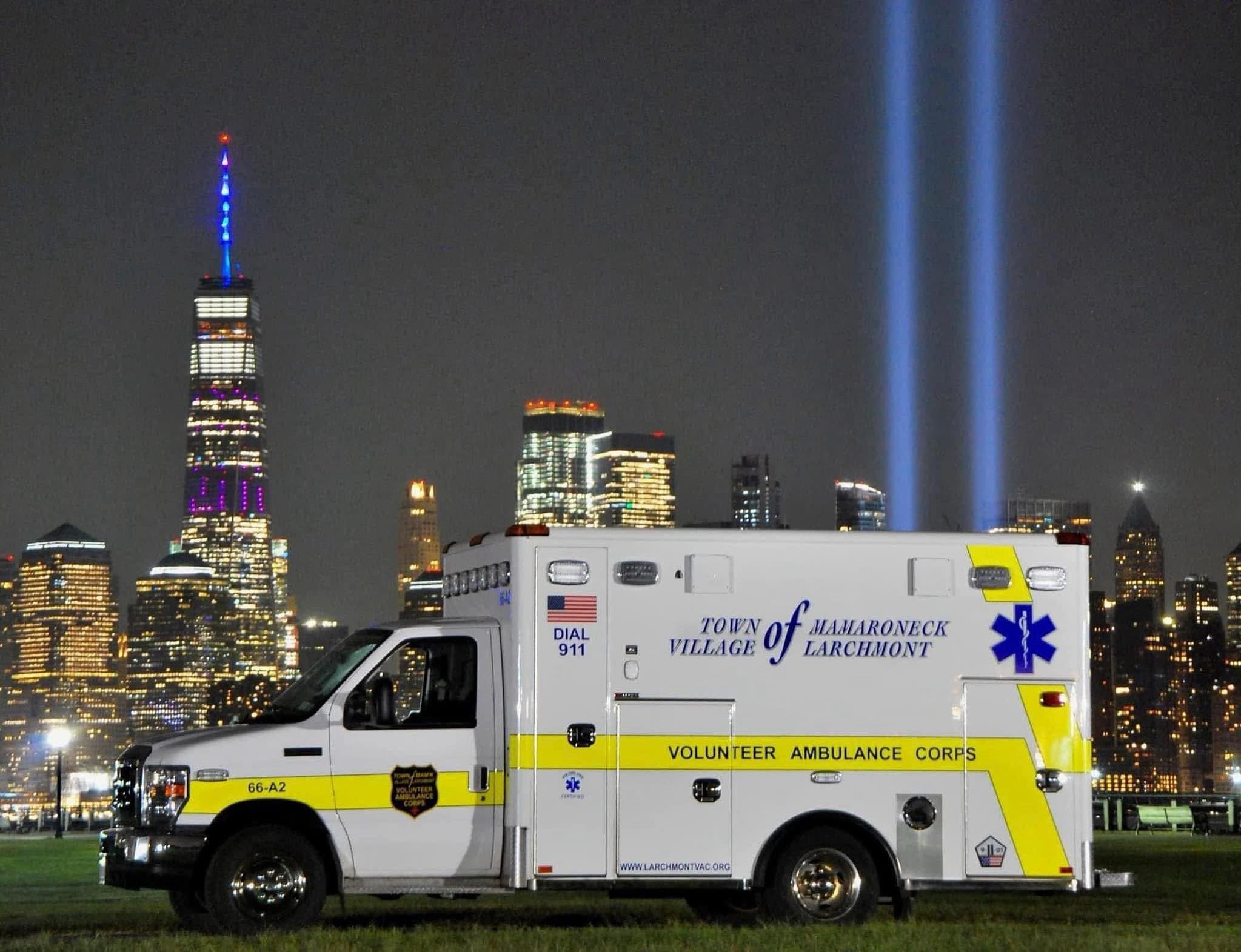 Larchmont VAC ambulance with the Tribute in Light over the New York City skyline